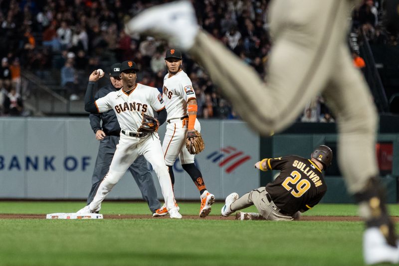 Sep 27, 2023; San Francisco, California, USA;  San Francisco Giants second baseman Thairo Estrada (39) tags San Diego Padres catcher Brett Sullivan (29) and throws to first base for a double play during the fifth inning at Oracle Park. Mandatory Credit: John Hefti-USA TODAY Sports