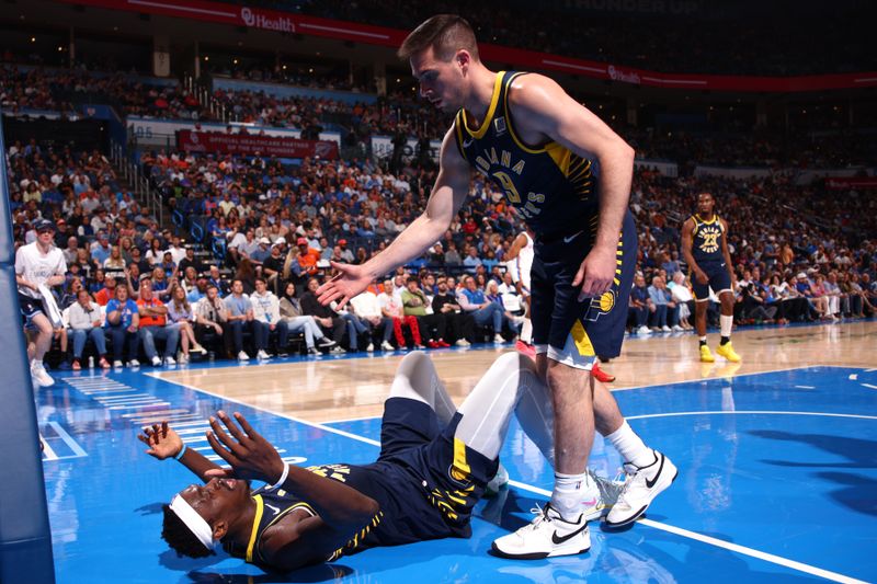 OKLAHOMA CITY, OK - MARCH 29: Pascal Siakam #43 of the Indiana Pacers helped off floor during the game against the Oklahoma City Thunder on March 29, 2025 at Paycom Center in Oklahoma City, Oklahoma. NOTE TO USER: User expressly acknowledges and agrees that, by downloading and or using this photograph, User is consenting to the terms and conditions of the Getty Images License Agreement. Mandatory Copyright Notice: Copyright 2025 NBAE (Photo by Zach Beeker/NBAE via Getty Images)