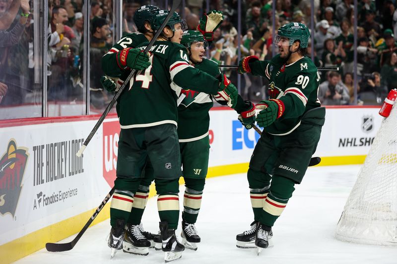 Oct 10, 2024; Saint Paul, Minnesota, USA; Minnesota Wild center Joel Eriksson Ek (14) celebrates his goal with teammates against the Columbus Blue Jackets during the second period at Xcel Energy Center. Mandatory Credit: Matt Krohn-Imagn Images