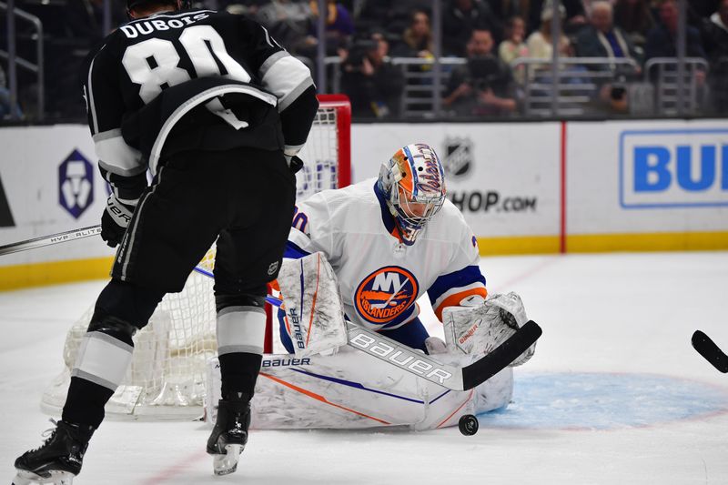 Mar 11, 2024; Los Angeles, California, USA; New York Islanders goaltender Ilya Sorokin (30) blocks a shot against Los Angeles Kings center Pierre-Luc Dubois (80) during the second period at Crypto.com Arena. Mandatory Credit: Gary A. Vasquez-USA TODAY Sports