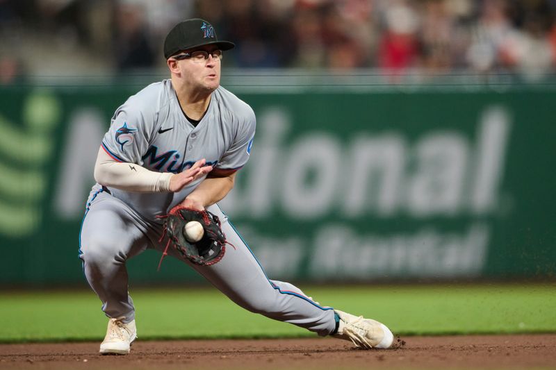 Aug 31, 2024; San Francisco, California, USA; Miami Marlins infielder Jonah Bride (41) fields a ground ball against the San Francisco Giants during the eighth inning at Oracle Park. Mandatory Credit: Robert Edwards-USA TODAY Sports