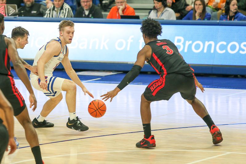 Feb 19, 2023; Boise, Idaho, USA; UNLV Rebels guard Shane Nowell (3) guards Boise State Broncos guard Jace Whiting (15) during the second half at ExtraMile Arena. Boise State beats UNLV 73-69.   Mandatory Credit: Brian Losness-USA TODAY Sports
