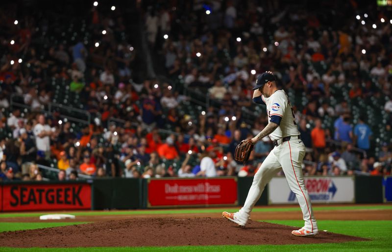 Aug 29, 2024; Houston, Texas, USA; Houston Astros relief pitcher Ryan Pressly (55) comes in to pitch against the Kansas City Royals in the eighth inning at Minute Maid Park. Mandatory Credit: Thomas Shea-USA TODAY Sports