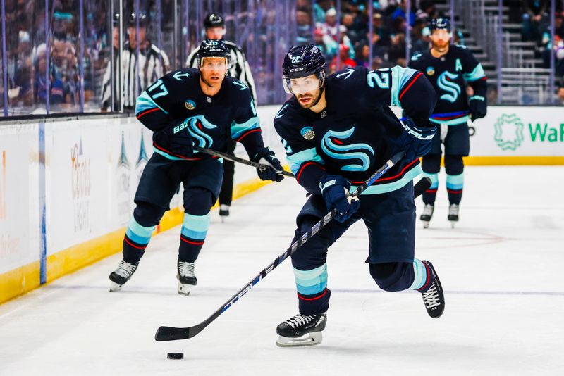 Nov 17, 2024; Seattle, Washington, USA; Seattle Kraken right wing Oliver Bjorkstrand (22) skates with the puck against the New York Rangers during the first period at Climate Pledge Arena. Mandatory Credit: Joe Nicholson-Imagn Images