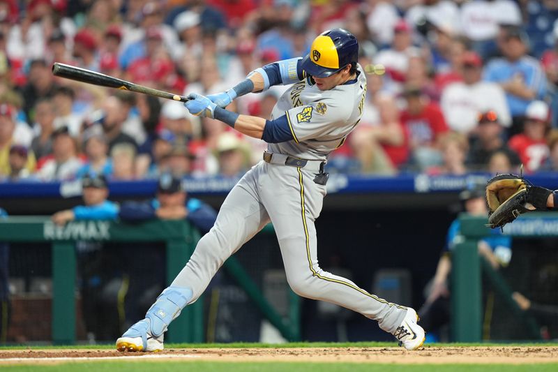 May 30, 2025; Philadelphia, Pennsylvania, USA; Milwaukee Brewers outfielder Christian Yelich (22) hits a single against the Philadelphia Phillies in the third inning at Citizens Bank Park. Mandatory Credit: Kyle Ross-Imagn Images