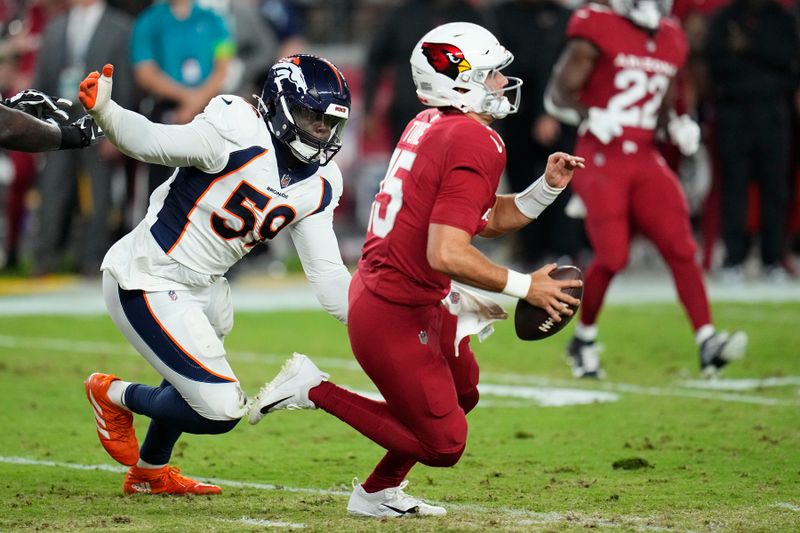 Arizona Cardinals quarterback Clayton Tune, right, runs past Denver Broncos linebacker Thomas Incoom (59) during the second half of an NFL preseason football game, Friday, Aug. 11, 2023, in Glendale, Ariz. (AP Photo/Ross D. Franklin)