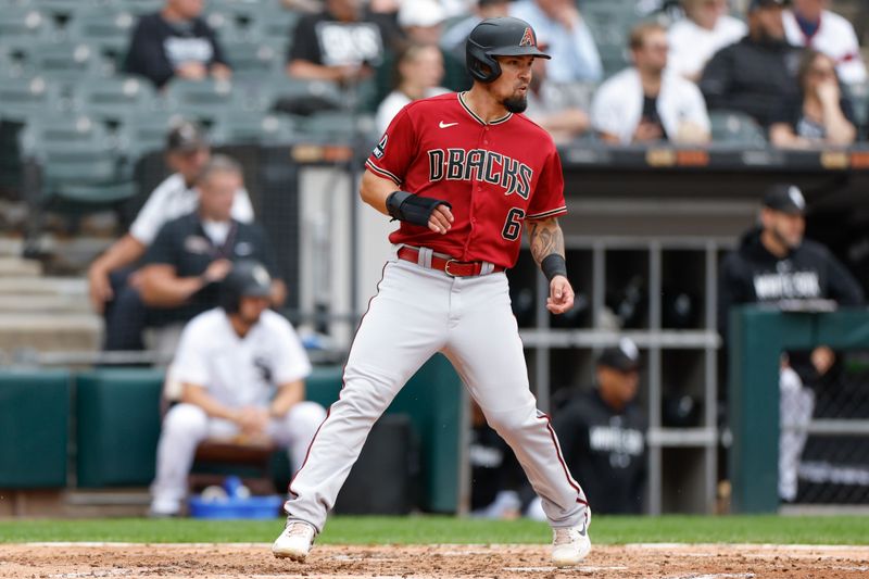 Sep 27, 2023; Chicago, Illinois, USA; Arizona Diamondbacks third baseman Jace Peterson (6) scores against the Chicago White Sox during the third inning at Guaranteed Rate Field. Mandatory Credit: Kamil Krzaczynski-USA TODAY Sports