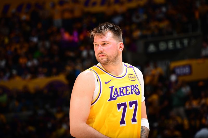 LOS ANGELES, CA - FEBRUARY 10:  Luka Doncic #77 of the Los Angeles Lakers looks on during the game against the Utah Jazz on February 10, 2025 at Crypto.Com Arena in Los Angeles, California. NOTE TO USER: User expressly acknowledges and agrees that, by downloading and/or using this Photograph, user is consenting to the terms and conditions of the Getty Images License Agreement. Mandatory Copyright Notice: Copyright 2025 NBAE (Photo by Adam Pantozzi/NBAE via Getty Images)