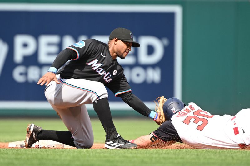 Sep 15, 2024; Washington, District of Columbia, USA; Miami Marlins second baseman Otto Lopez (61) tags out  Washington Nationals center fielder Jacob Young (30) at second base during a stolen base attempt during the third inning at Nationals Park. Mandatory Credit: Rafael Suanes-Imagn Images