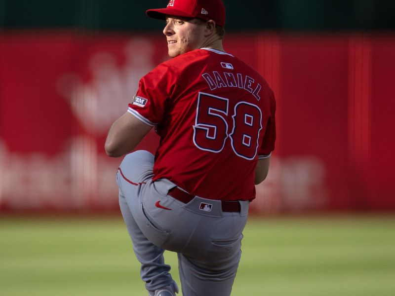 Jul 3, 2024; Oakland, California, USA; Los Angeles Angels starting pitcher Davis Daniel (58) delivers a pitch against the Oakland Athletics during the first inning at Oakland-Alameda County Coliseum. Mandatory Credit: D. Ross Cameron-USA TODAY Sports