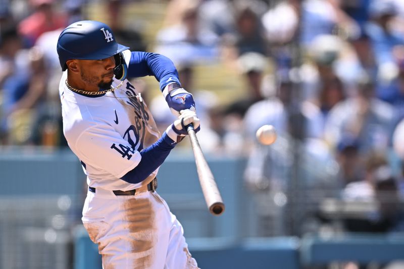 Apr 20, 2024; Los Angeles, California, USA; Los Angeles Dodgers shortstop Mookie Betts (50) flys out against the New York Mets during the fourth inning at Dodger Stadium. Mandatory Credit: Jonathan Hui-USA TODAY Sports
