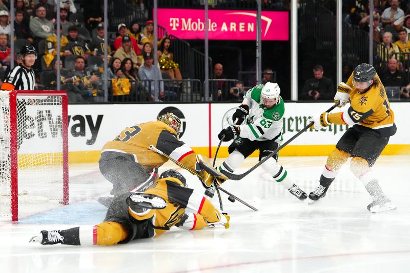 May 3, 2024; Las Vegas, Nevada, USA; Vegas Golden Knights goaltender Adin Hill (33) makes a save against Dallas Stars right wing Evgenii Dadonov (63) as defenseman Noah Hanifin (15) attempts to block the attempt during the second period of game six of the first round of the 2024 Stanley Cup Playoffs at T-Mobile Arena. Mandatory Credit: Stephen R. Sylvanie-USA TODAY Sports