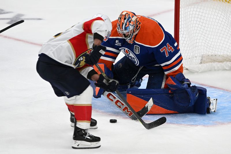 Jun 6, 2025; Edmonton, Alberta, CAN; Florida Panthers center Brad Marchand (63) scores the game winning goal against Edmonton Oilers goaltender Stuart Skinner (74) during double overtime in game two of the 2025 Stanley Cup Final at Rogers Place. Mandatory Credit: Walter Tychnowicz-Imagn Images