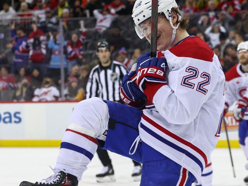 Jan 17, 2024; Newark, New Jersey, USA; Montreal Canadiens right wing Cole Caufield (22) celebrates his goal against the New Jersey Devils during the third period at Prudential Center. Mandatory Credit: Ed Mulholland-USA TODAY Sports