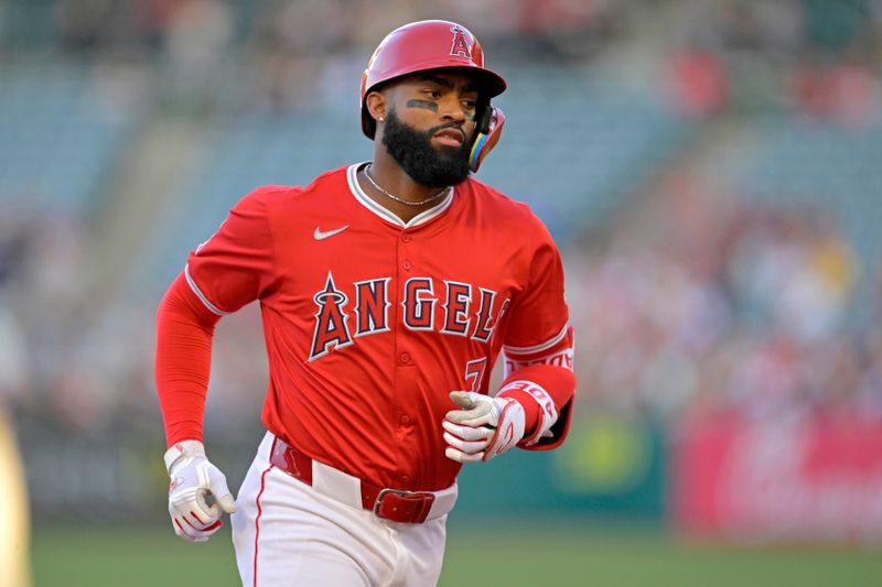 Apr 29, 2024; Anaheim, California, USA; Los Angeles Angels outfielder Jo Adell (7) rounds the bases after hitting a solo home run in the first inning against the Philadelphia Phillies at Angel Stadium. Mandatory Credit: Jayne Kamin-Oncea-USA TODAY Sports