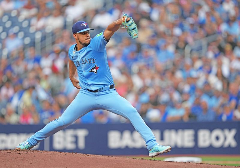 Jul 23, 2024; Toronto, Ontario, CAN; Toronto Blue Jays starting pitcher Jose Berríos (17) throws a pitch against the Tampa Bay Rays during the first inning at Rogers Centre. Mandatory Credit: Nick Turchiaro-USA TODAY Sports