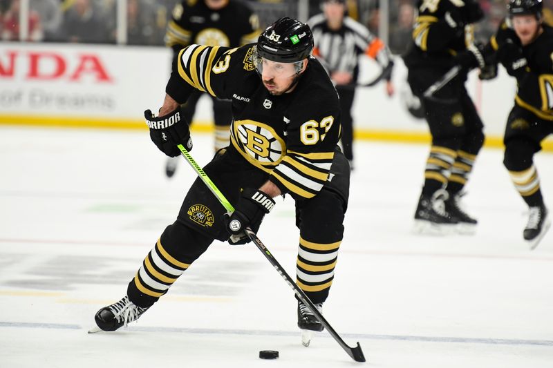 May 17, 2024; Boston, Massachusetts, USA; Boston Bruins left wing Brad Marchand (63) controls the puck during the third period in game six of the second round of the 2024 Stanley Cup Playoffs against the Florida Panthers at TD Garden. Mandatory Credit: Bob DeChiara-USA TODAY Sports