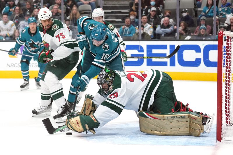 Mar 11, 2023; San Jose, California, USA; Minnesota Wild goaltender Marc-Andre Fleury (29) reaches for the puck against San Jose Sharks center Steven Lorentz (16) during the second period at SAP Center at San Jose. Mandatory Credit: Darren Yamashita-USA TODAY Sports