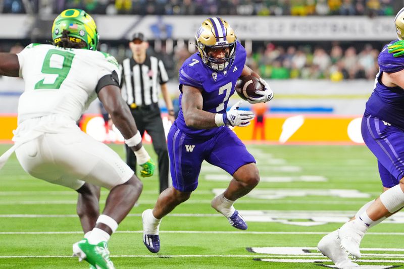 Dec 1, 2023; Las Vegas, NV, USA; Washington Huskies running back Dillon Johnson (7) rushes against the Oregon Ducks during the fourth quarter at Allegiant Stadium. Mandatory Credit: Stephen R. Sylvanie-USA TODAY Sports