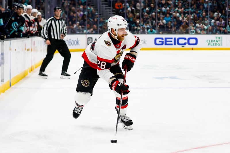 Jan 4, 2024; Seattle, Washington, USA; Ottawa Senators right wing Claude Giroux (28) looks to pass the puck against the Seattle Kraken during the first period at Climate Pledge Arena. Mandatory Credit: Joe Nicholson-USA TODAY Sports