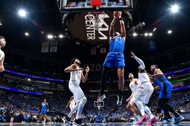 ORLANDO, FL - APRIL 25: Paolo Banchero #5 of the Orlando Magic goes to the basket during the game against the Cleveland Cavaliers during Round 1 Game 3 of the 2024 NBA Playoffs on April 25, 2024 at Kia Center in Orlando, Florida. NOTE TO USER: User expressly acknowledges and agrees that, by downloading and or using this photograph, User is consenting to the terms and conditions of the Getty Images License Agreement. Mandatory Copyright Notice: Copyright 2023 NBAE (Photo by Fernando Medina/NBAE via Getty Images)