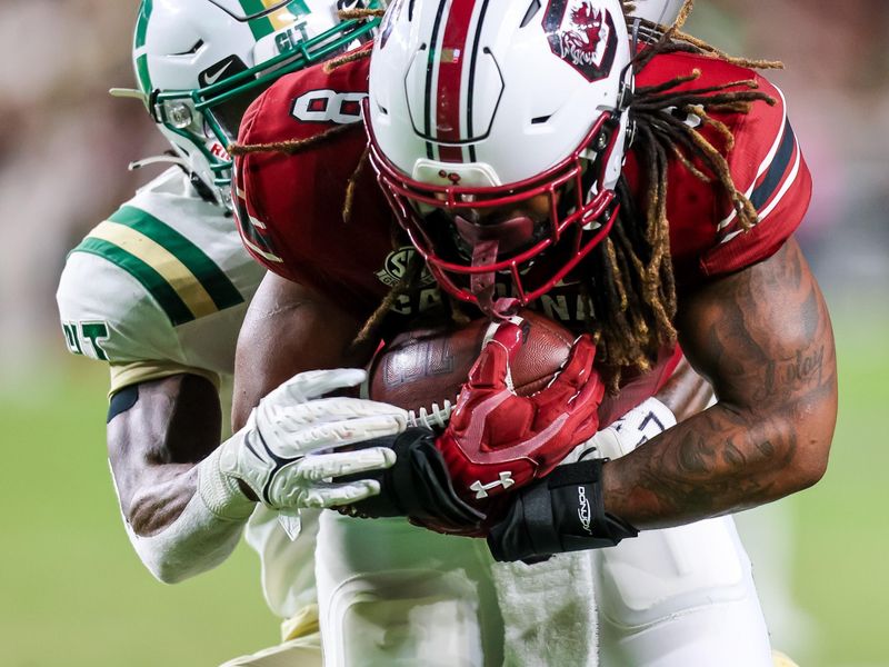 Sep 24, 2022; Columbia, South Carolina, USA; South Carolina Gamecocks running back Christian Beal-Smith (8) is brought down by Charlotte 49ers defensive back Valerian Agbaw (9) in the second quarter at Williams-Brice Stadium. Mandatory Credit: Jeff Blake-USA TODAY Sports