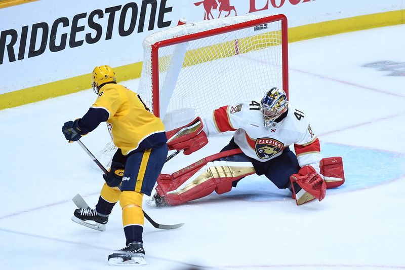 Jan 22, 2024; Nashville, Tennessee, USA; Florida Panthers goaltender Anthony Stolarz (41) stops a between the leg shot by Nashville Predators left wing Filip Forsberg (9) during the second period at Bridgestone Arena. Mandatory Credit: Christopher Hanewinckel-USA TODAY Sports