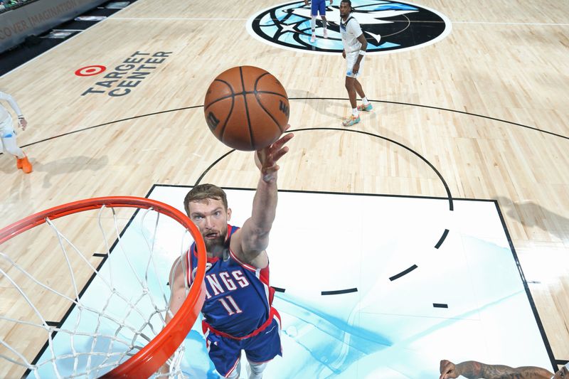 MINNEAPOLIS, MN -  NOVEMBER 27: Domantas Sabonis #11 of the Sacramento Kings drives to the basket during the game against the Minnesota Timberwolves on November 27, 2024 at Target Center in Minneapolis, Minnesota. NOTE TO USER: User expressly acknowledges and agrees that, by downloading and or using this Photograph, user is consenting to the terms and conditions of the Getty Images License Agreement. Mandatory Copyright Notice: Copyright 2024 NBAE (Photo by David Sherman/NBAE via Getty Images)