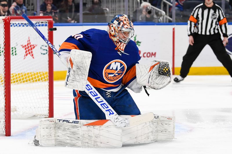 Dec 13, 2023; Elmont, New York, USA; New York Islanders goaltender Semyon Varlamov (40) makes a save against the Anaheim Ducks during the first period at UBS Arena. Mandatory Credit: Dennis Schneidler-USA TODAY Sports