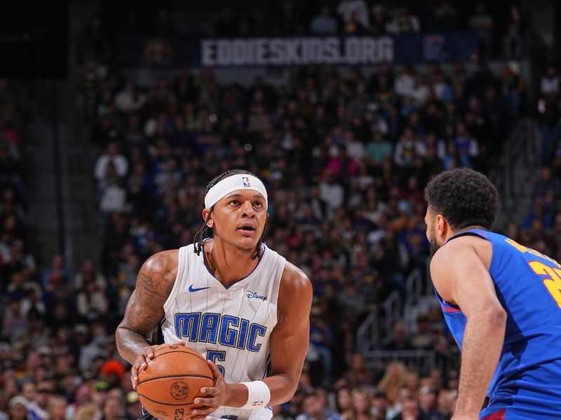 DENVER, CO - JANUARY 5: Paolo Banchero #5 of the Orlando Magic handles the ball during the game against the Denver Nuggets on January 5, 2024 at the Ball Arena in Denver, Colorado. NOTE TO USER: User expressly acknowledges and agrees that, by downloading and/or using this Photograph, user is consenting to the terms and conditions of the Getty Images License Agreement. Mandatory Copyright Notice: Copyright 2024 NBAE (Photo by Bart Young/NBAE via Getty Images)