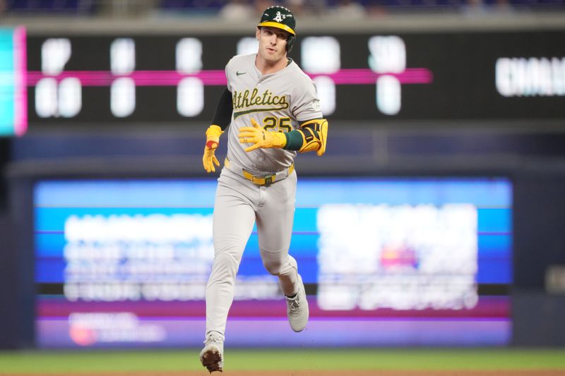 May 3, 2025; Miami, Florida, USA;  Oakland Athletics designated hitter Brent Rooker (25) rounds the bases after hitting a solo home run in the first inning against the Miami Marlins at loanDepot Park. Mandatory Credit: Jim Rassol-Imagn Images