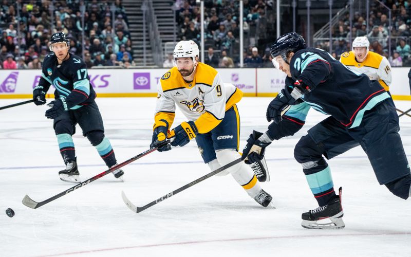 Nov 20, 2024; Seattle, Washington, USA;  Nashville Predators forward Filip Forsberg (9) skates against  defenseman Jamie Oleksiak (24) during the third period at Climate Pledge Arena. Mandatory Credit: Stephen Brashear-Imagn Images