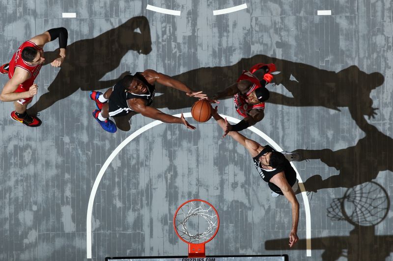 MEMPHIS, TN - FEBRUARY 8: GG Jackson #45 and Santi Aldama #7 of the Memphis Grizzlies go up for the rebound during the game against the Chicago Bulls on February 8, 2024 at FedExForum in Memphis, Tennessee. NOTE TO USER: User expressly acknowledges and agrees that, by downloading and or using this photograph, User is consenting to the terms and conditions of the Getty Images License Agreement. Mandatory Copyright Notice: Copyright 2024 NBAE (Photo by Joe Murphy/NBAE via Getty Images)