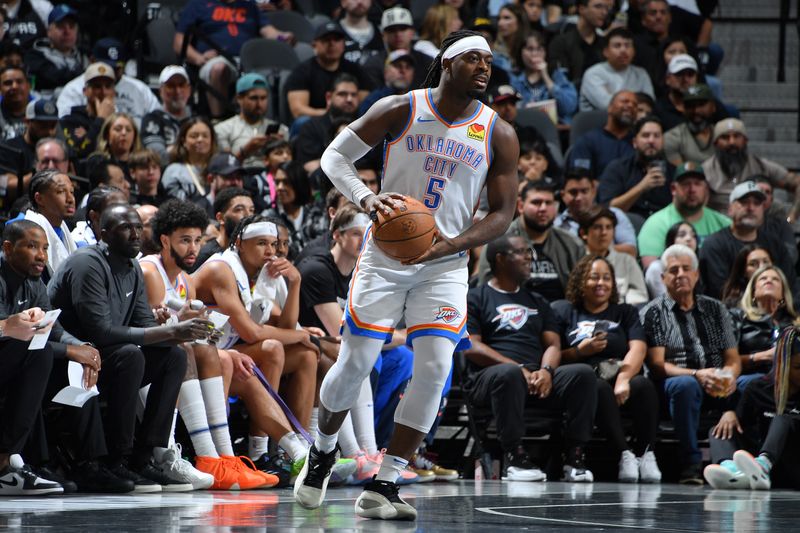 SAN ANTONIO, TX - NOVEMBER 19: Luguentz Dort #5 of the Oklahoma City Thunder handles the ball during the game against the San Antonio Spurs during the Emirates NBA Cup game on November 19, 2024 at the Frost Bank Center in San Antonio, Texas. NOTE TO USER: User expressly acknowledges and agrees that, by downloading and or using this photograph, user is consenting to the terms and conditions of the Getty Images License Agreement. Mandatory Copyright Notice: Copyright 2024 NBAE (Photos by Michael Gonzales/NBAE via Getty Images)