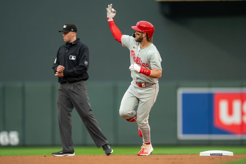 Jul 22, 2024; Minneapolis, Minnesota, USA; Philadelphia Phillies first baseman Bryce Harper (3) celebrates hitting a a two run home run against the Minnesota Twins in the first inning at Target Field. Mandatory Credit: Jesse Johnson-USA TODAY Sports