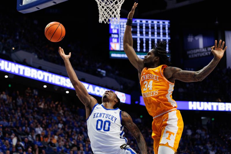 Feb 11, 2025; Lexington, Kentucky, USA; Kentucky Wildcats guard Otega Oweh (00) goes to the basket against Tennessee Volunteers forward Felix Okpara (34) during the second half at Rupp Arena at Central Bank Center. Mandatory Credit: Jordan Prather-Imagn Images