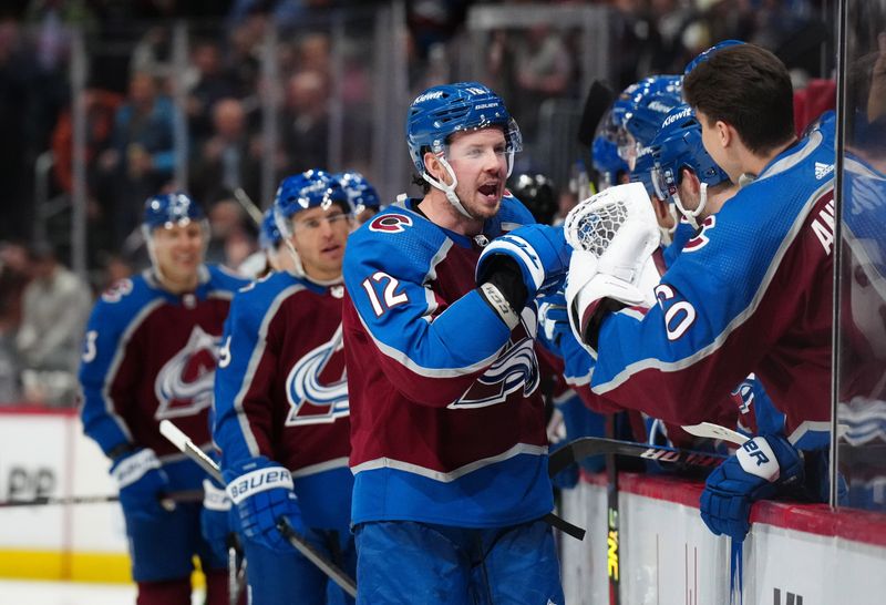 Feb 20, 2024; Denver, Colorado, USA; Colorado Avalanche center Ryan Johansen (12) celebrates his goal ahead goal in the third period against the Vancouver Canucks at Ball Arena. Mandatory Credit: Ron Chenoy-USA TODAY Sports