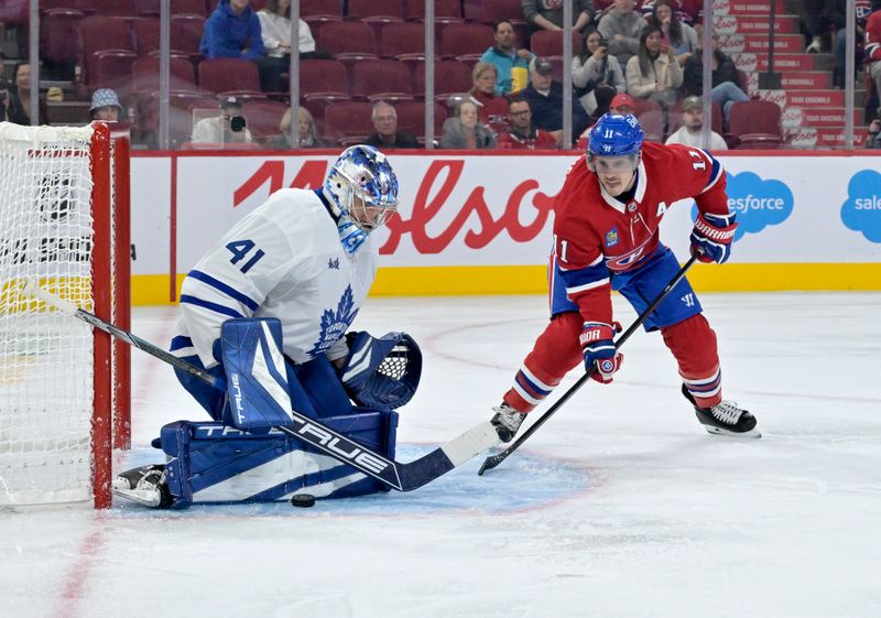 Oct 9, 2024; Montreal, Quebec, CAN; Toronto Maple Leafs  (41) redirects the puck away from Montreal Canadiens forward Brendan Gallagher (11) during the second period at the Bell Centre. Mandatory Credit: Eric Bolte-Imagn Images