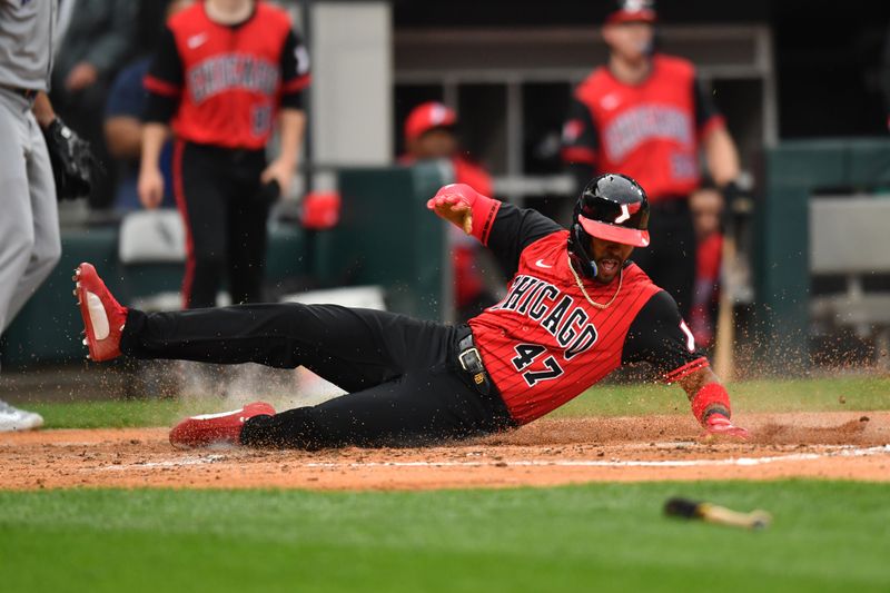 Jun 6, 2025; Chicago, Illinois, USA; Chicago White Sox left fielder Joshua Palacios (47) slides into home plate to score during the second inning against the Kansas City Royals at Rate Field. Mandatory Credit: Patrick Gorski-Imagn Images