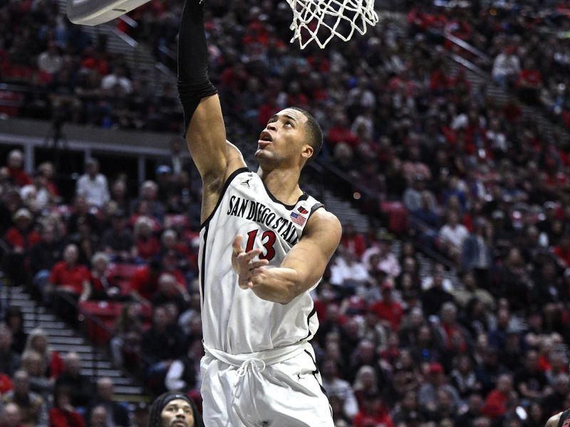 Jan 6, 2024; San Diego, California, USA; San Diego State Aztecs forward Jaedon LeDee (13) goes to the basket during the second half against the UNLV Rebels at Viejas Arena. Mandatory Credit: Orlando Ramirez-USA TODAY Sports