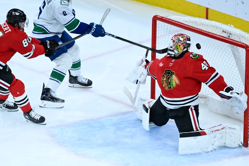 Mar 6, 2026; Chicago, Illinois, USA;  Vancouver Canucks right wing Brock Boeser (6) scores a goal past Chicago Blackhawks goaltender Arvid Soderblom (40) and left wing Landon Slaggert (84) during the third period at United Center. Mandatory Credit: Matt Marton-Imagn Images