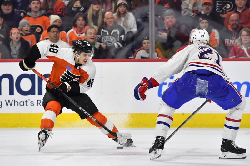 Jan 10, 2024; Philadelphia, Pennsylvania, USA; Philadelphia Flyers center Morgan Frost (48) moves past Montreal Canadiens defenseman Kaiden Guhle (21) during third period at Wells Fargo Center. Mandatory Credit: Eric Hartline-USA TODAY Sports