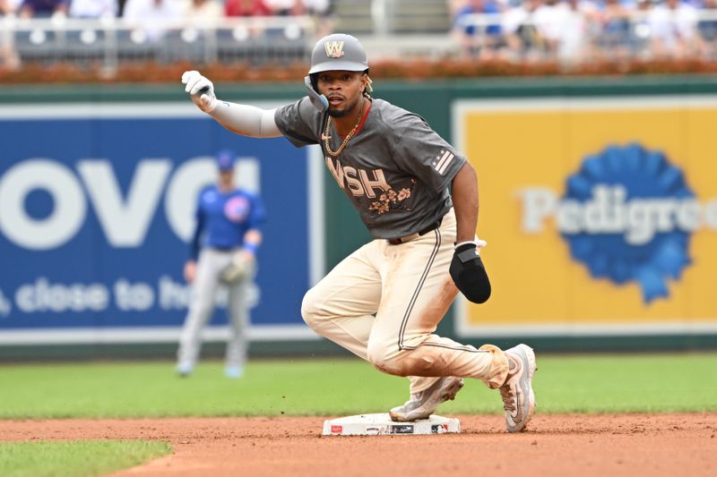 Aug 31, 2024; Washington, District of Columbia, USA; Washington Nationals shortstop Jose Tena (8) slides into second base against the Chicago Cubs during the second inning at Nationals Park. Mandatory Credit: Rafael Suanes-USA TODAY Sports