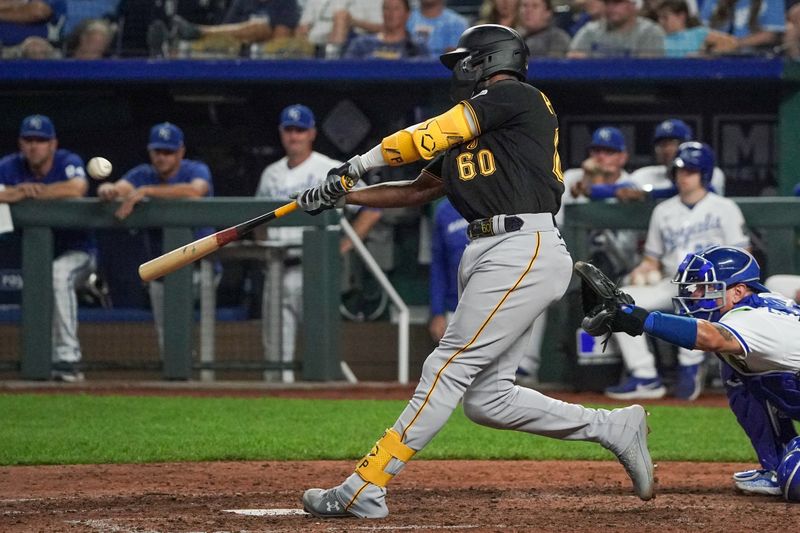 Aug 29, 2023; Kansas City, Missouri, USA; Pittsburgh Pirates shortstop Liover Peguero (60) hits a three-run home run against the Kansas City Royals in the ninth inning at Kauffman Stadium. Mandatory Credit: Denny Medley-USA TODAY Sports