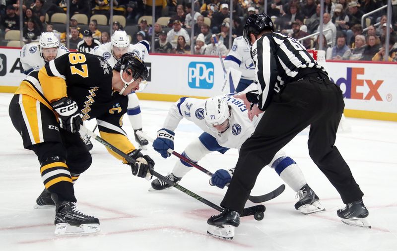 Nov 19, 2024; Pittsburgh, Pennsylvania, USA;  Pittsburgh Penguins center Sidney Crosby (87) wins a face-off against Tampa Bay Lightning center Anthony Cirelli (71) during the first period at PPG Paints Arena. Mandatory Credit: Charles LeClaire-Imagn Images