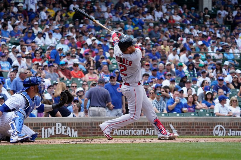 Jul 15, 2023; Chicago, Illinois, USA; Boston Red Sox designated hitter Justin Turner (2) hits a double against the Chicago Cubs during the first inning at Wrigley Field. Mandatory Credit: David Banks-USA TODAY Sports