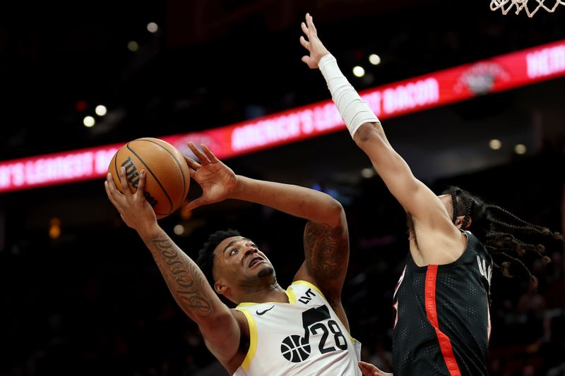 PORTLAND, OREGON - DECEMBER 06: Brice Sensabaugh #28 of the Utah Jazz shoots against Dalano Banton #5 of the Portland Trail Blazers during the first half at Moda Center on December 06, 2024 in Portland, Oregon. NOTE TO USER: User expressly acknowledges and agrees that, by downloading and or using this photograph, User is consenting to the terms and conditions of the Getty Images License Agreement. (Photo by Steph Chambers/Getty Images)