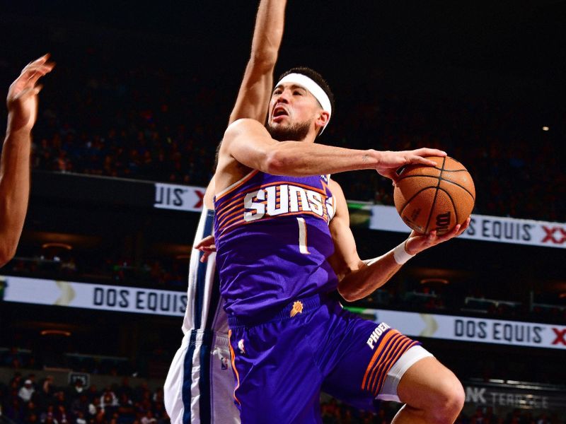 PHOENIX, AZ - JANUARY 7: Devin Booker #1 of the Phoenix Suns shoots the ball during the game against the Memphis Grizzlies on January 7, 2024 at Footprint Center in Phoenix, Arizona. NOTE TO USER: User expressly acknowledges and agrees that, by downloading and or using this photograph, user is consenting to the terms and conditions of the Getty Images License Agreement. Mandatory Copyright Notice: Copyright 2024 NBAE (Photo by Barry Gossage/NBAE via Getty Images)