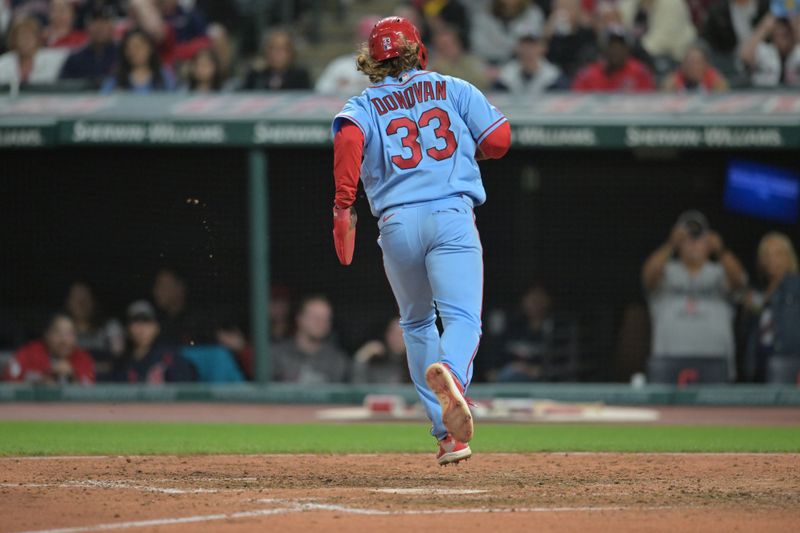 May 27, 2023; Cleveland, Ohio, USA; St. Louis Cardinals right fielder Brendan Donovan (33) scores on a passed ball during the tenth inning against the Cleveland Guardians at Progressive Field. Mandatory Credit: Ken Blaze-USA TODAY Sports