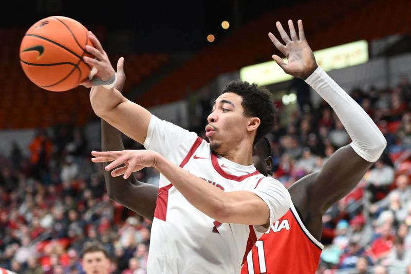 Jan 13, 2024; Pullman, Washington, USA; Washington State Cougars guard Myles Rice (2) passes the ball on the drive against Arizona Wildcats center Oumar Ballo (11) in the first half at Friel Court at Beasley Coliseum. Mandatory Credit: James Snook-USA TODAY Sports